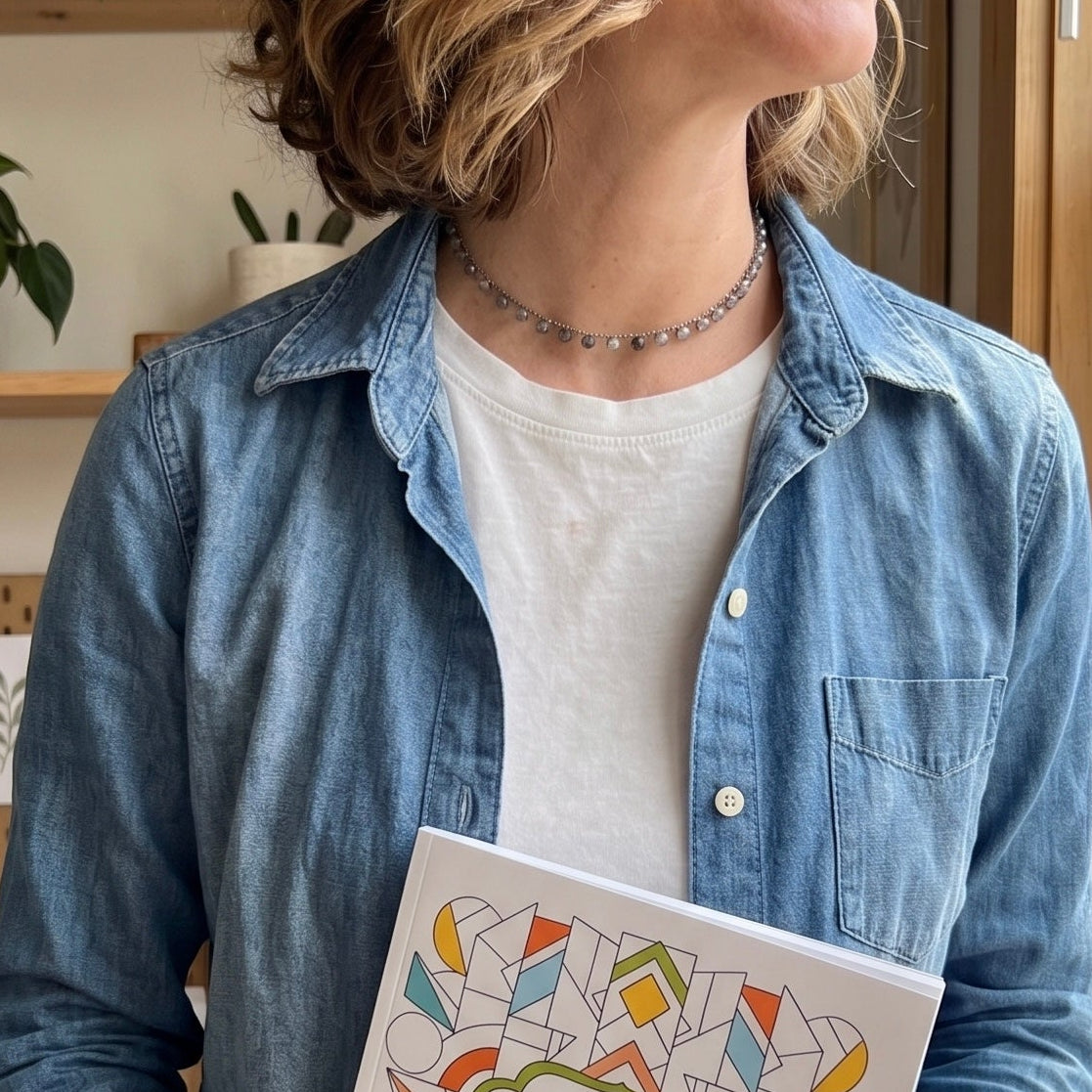 the artist holding the mindful coloring book