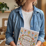 the artist holding the mindful coloring book